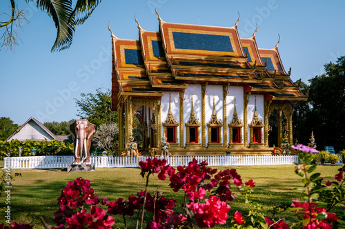 Khuk Khak Temple ,Khao Lak Thailand, Buddhist temple Khuek Khak Temple on a sunny day photo