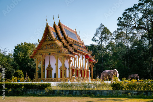 Khuk Khak Temple ,Khao Lak Thailand, Buddhist temple Khuek Khak Temple on a sunny day photo