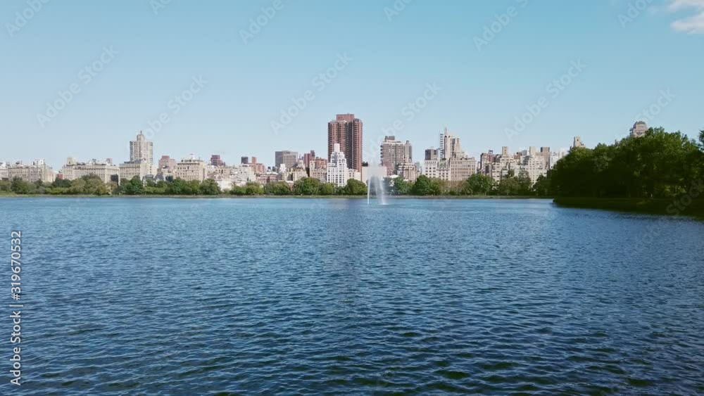 Central park lake with a fountain in New York Central park lake with a fountain in New York