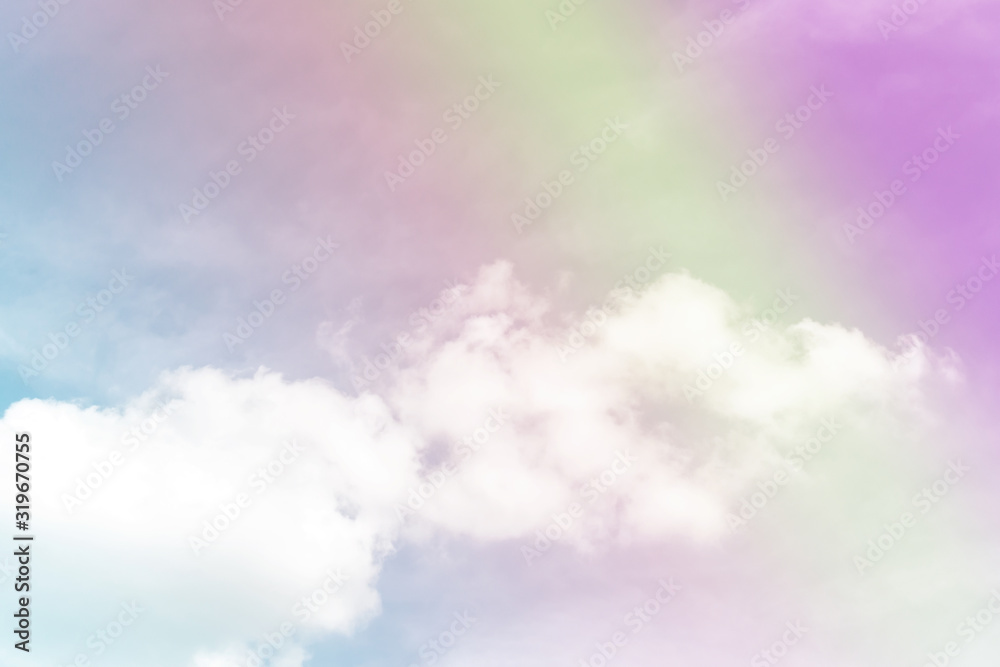 Beautiful pastel color with rainbow shade on white fluffy clouds, colorful blue sky on background, upward view and copy space image Beautiful pastel color with rainbow shade on white fluffy clouds, colorful blue sky on background, upward view and copy space image