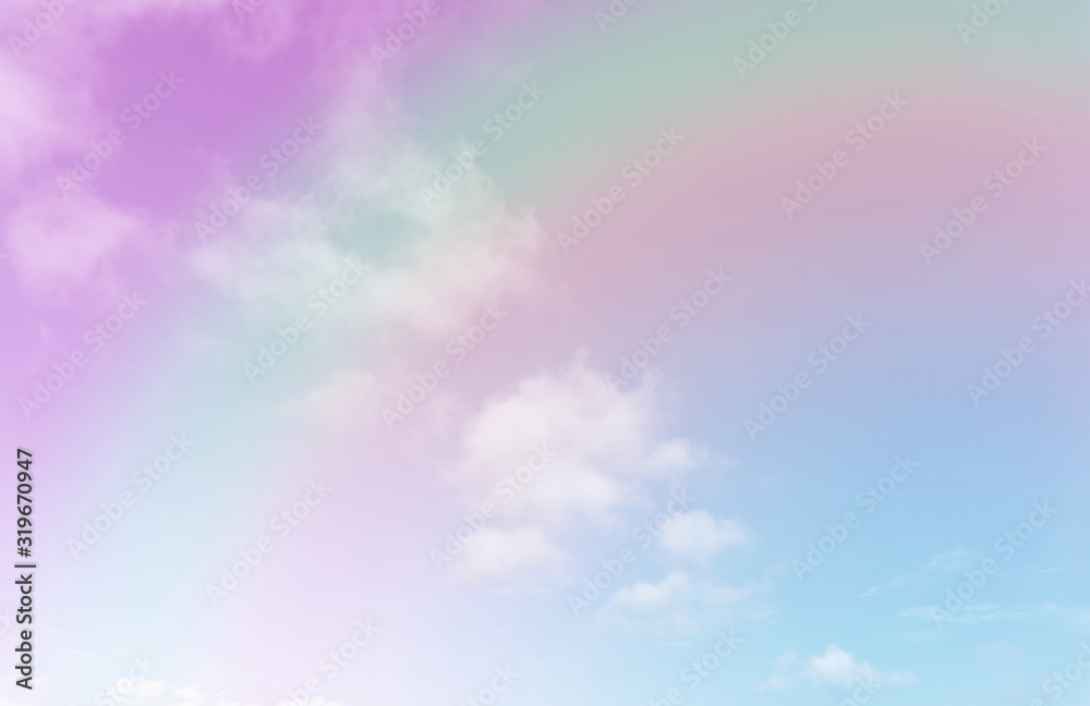 Beautiful pastel color with rainbow shade on white fluffy clouds, colorful blue sky on background, upward view and copy space image