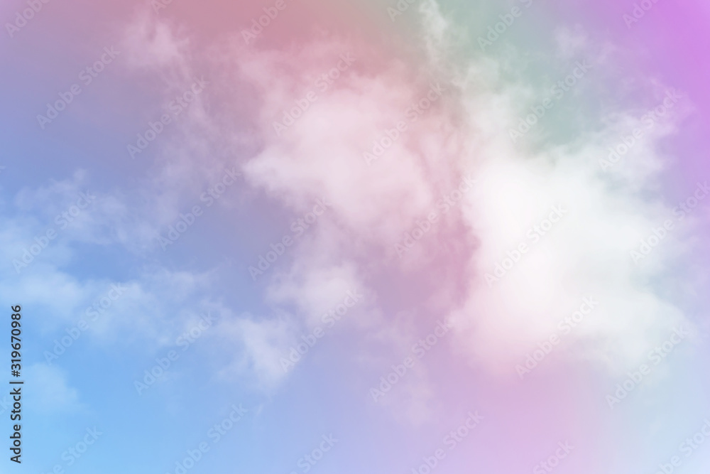 Beautiful pastel color with rainbow shade on white fluffy clouds, colorful blue sky on background, upward view and copy space image Beautiful pastel color with rainbow shade on white fluffy clouds, colorful blue sky on background, upward view and copy space image