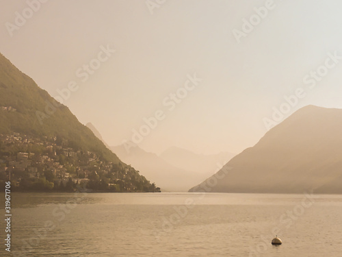 Alpine Lake Lugano and Mountain in Switzerland.