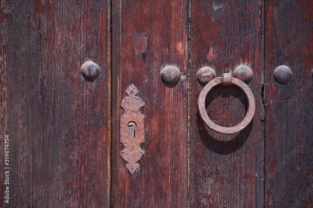 Old wooden door with aged metal door handle. Background, copy space. Old wooden door with aged metal door handle. Background, copy space.