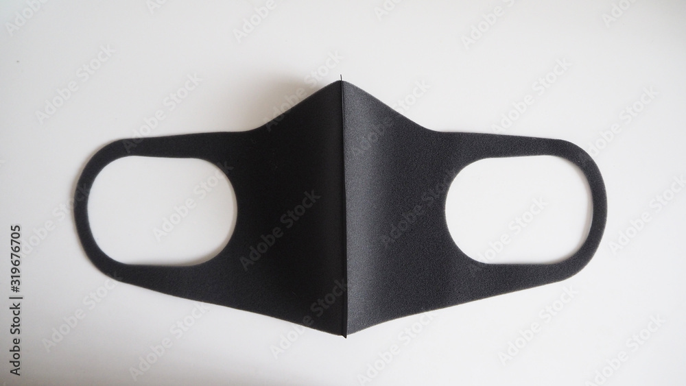 Black Mask help to protect Coronavirus virus and dust and other particle, put on white background. Black Mask help to protect Coronavirus virus and dust and other particle, put on white background.
