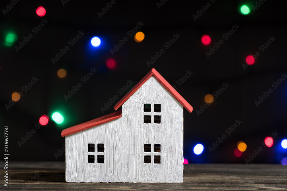Model home on darbackground. Mortgage concept. Front view closeup