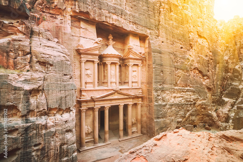 El Hazne famous rock temple-mausoleum, Treasury of Pharaoh. in the ancient city of Petra, Jordan: Incredible UNESCO World Heritage Site. An ancient structure with high columns carved into the rock photo