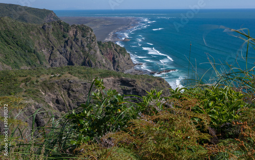 Karekare Auckland New Zealand. Coastline waves ocean