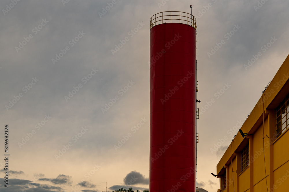 Industrial and vertical water box painted red Industrial and vertical water box painted red