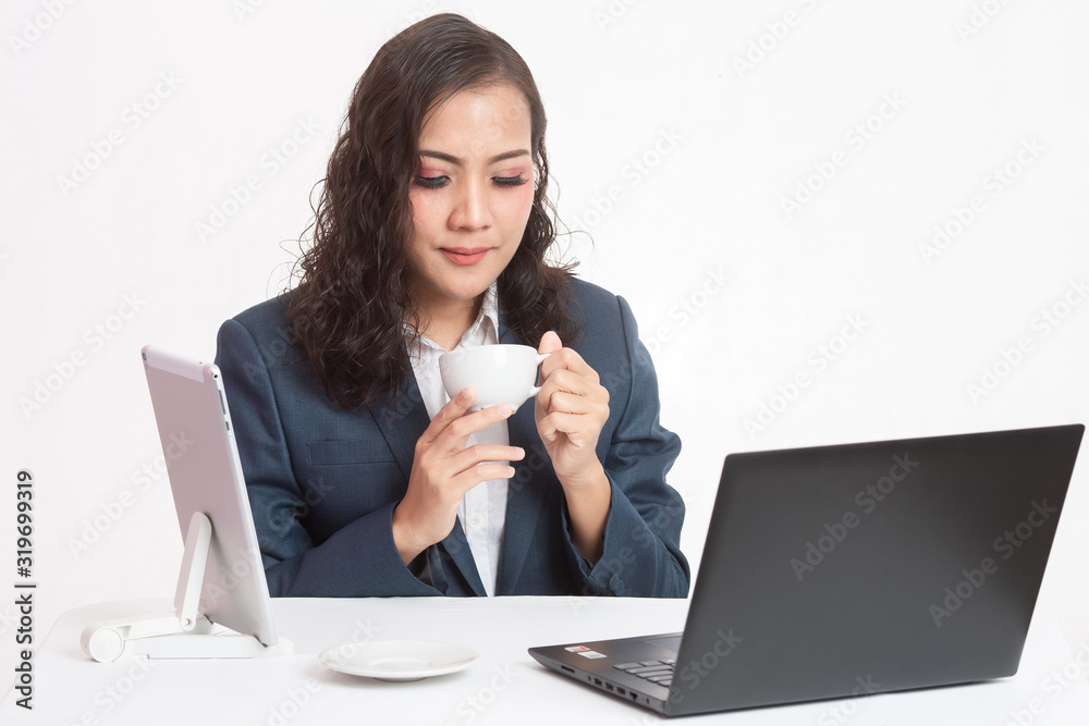 Beautiful young executive with her work and coffee Beautiful young executive with her work and coffee