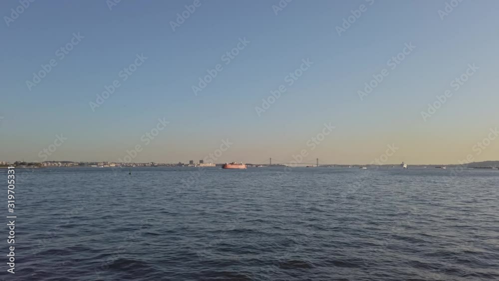 Hudson river and a floating touristic boat in New York Hudson river and a floating touristic boat in New York