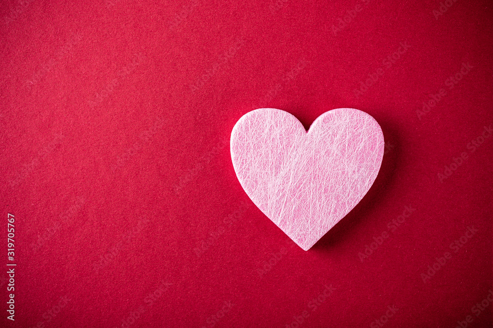 Valentine's Day background. Pink heart over red. Valentines day concept. Flat lay, top view, copy space