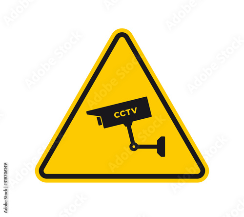 Vector yellow triangle sign - black silhouette road sign CCTV security camera. Isolated on white background.
