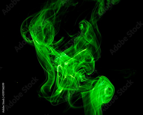 Green smoke on black background