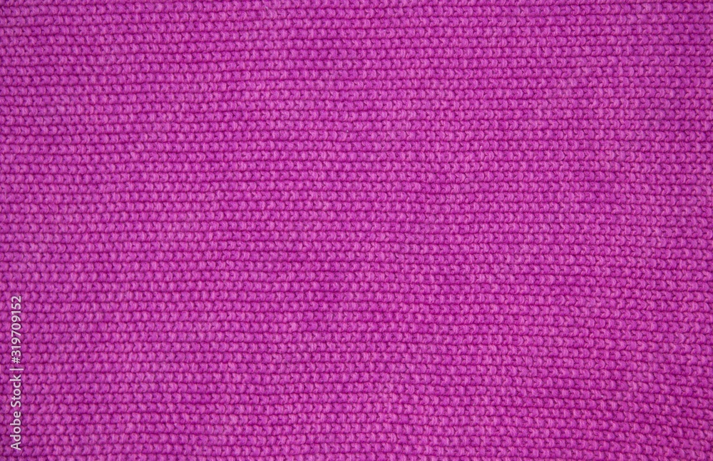 Pink wool yarn of knitted texture. Hand knitting. Close up. Pink background. Pink wool yarn of knitted texture. Hand knitting. Close up. Pink background.