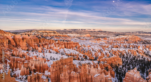 Sunset over Bryce Canyon National Park during winter covered with snow