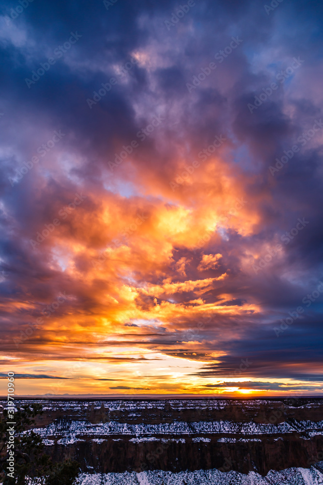 Obraz premium Dramatic orange sunset on the Grand Canyon after a storm 