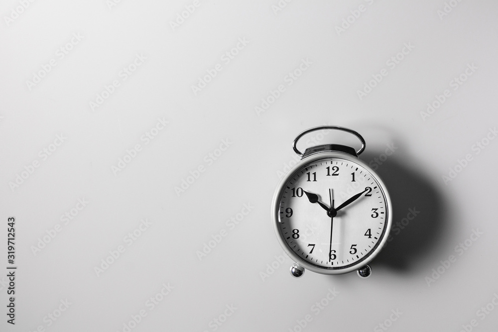 A white alarm clock on a white background A white alarm clock on a white background
