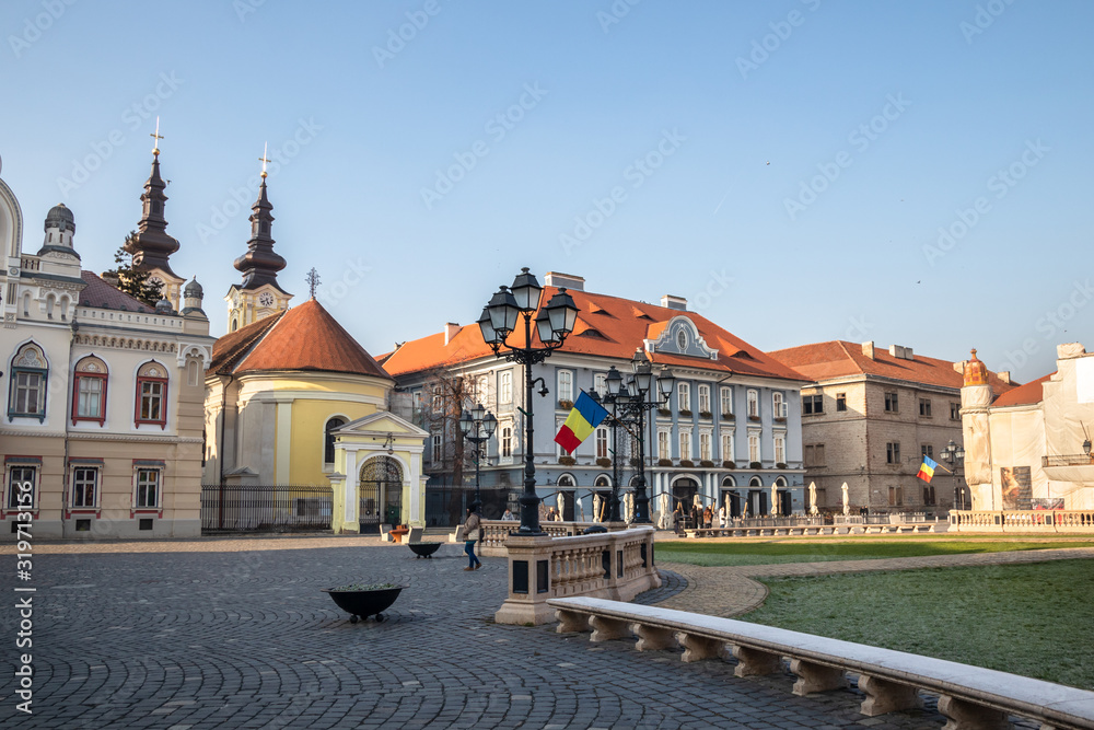 Union square in Timisoara with old historic buildings and churches. Romania, morning, winter day.