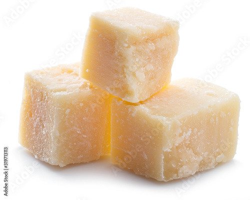 Parmesan cheese cubes isolated on white background.