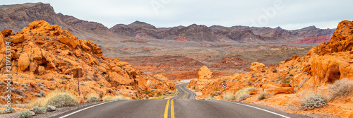 Canvas Print Panoramic shot of a desert road and orange rocks of Valley of Fire State Park, U