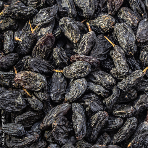 Wallpaper Mural Dark raisins on a white isolated background. Food brown-blue grapes delicious for your design for the site. kitchen theme Torontodigital.ca