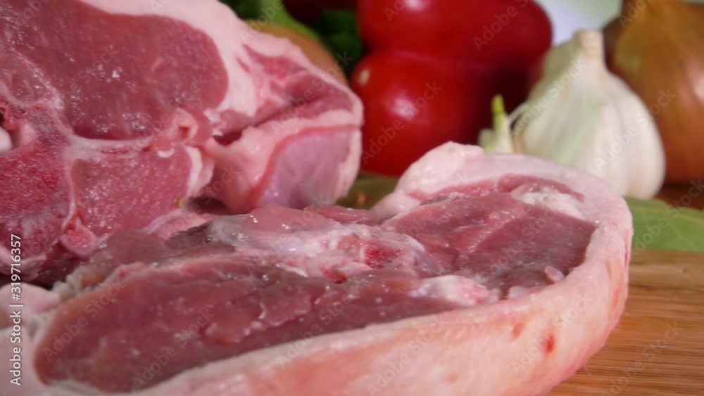Panorama of meat cut with a knife onto thick steak on the wooden board Panorama of meat cut with a knife onto thick steak on the wooden board