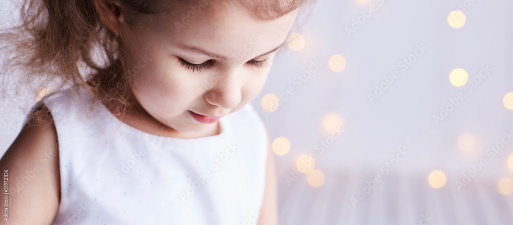 Fototapeta premium Little cute girl sale portrait. Photography of luxury female child. Happy winner emotion. Fresh person face. Kid eyes