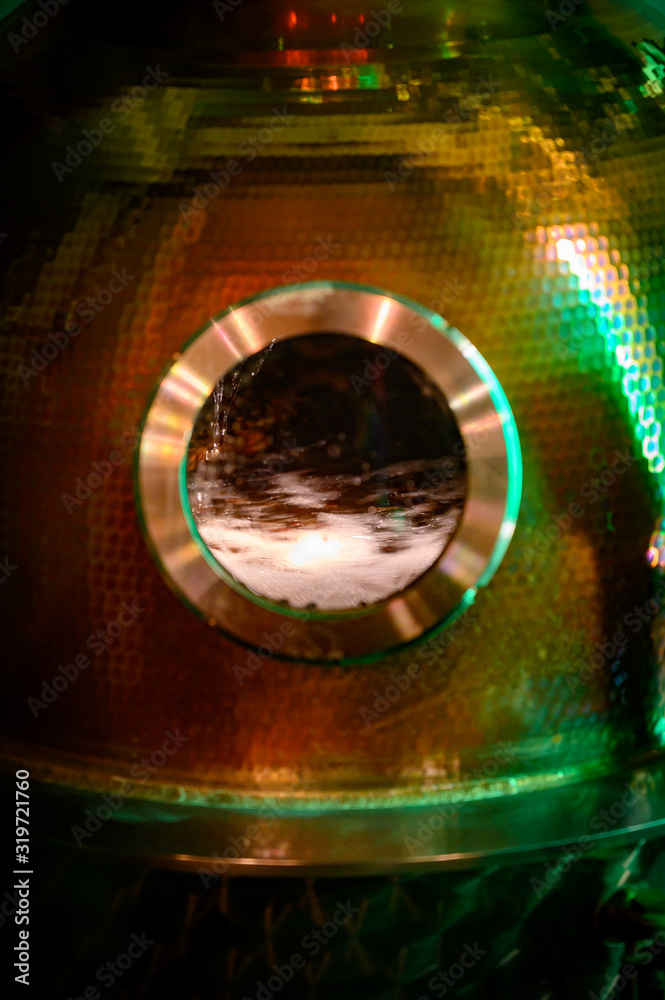 Fototapeta premium Gin distillation process in copper tanks, Scotland, UK