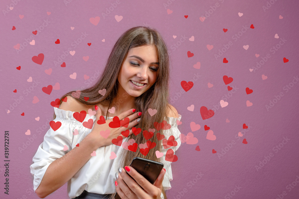 Valentine day concept, love message - hearts flying out smartphone in young, slim womans hands Valentine day concept, love message - hearts flying out smartphone in young, slim womans hands