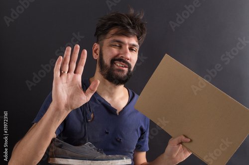 homeless tramp with a sign