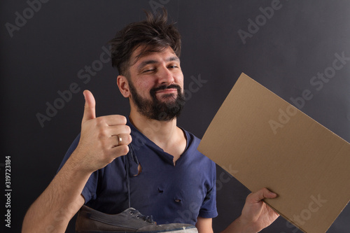 homeless tramp with a sign