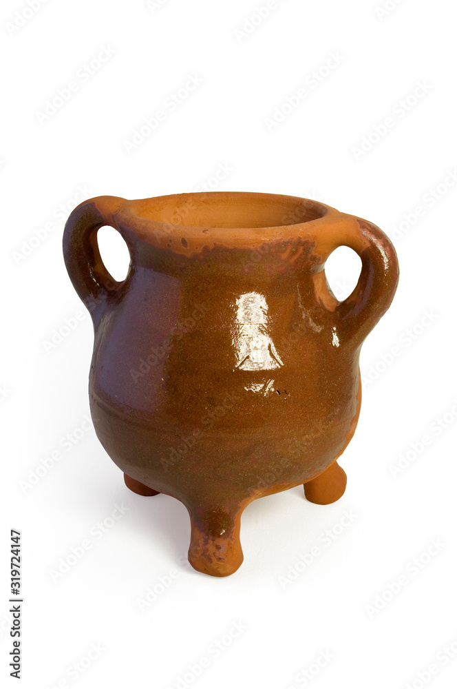 A three legged medieval cooking pot.