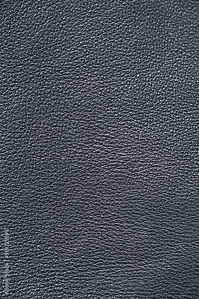 Genuine Leather. Gray background. Silver texture of leather material. Genuine Leather. Gray background. Silver texture of leather material.