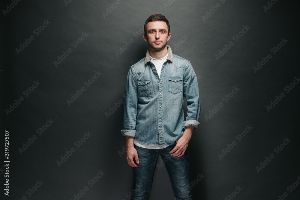 Hipster handsome male model wearing jeans clothes Hipster handsome male model wearing jeans clothes