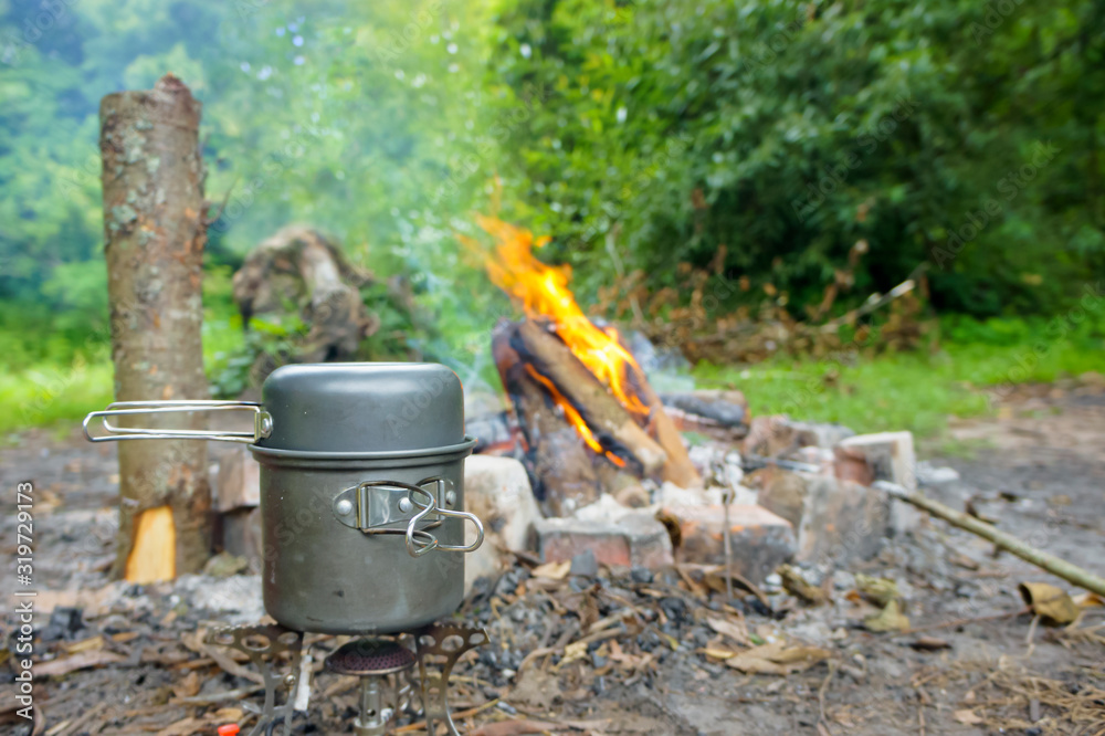 Cooking on a hike. Cooking tea over a fire. Cooking on a hike. Cooking tea over a fire.