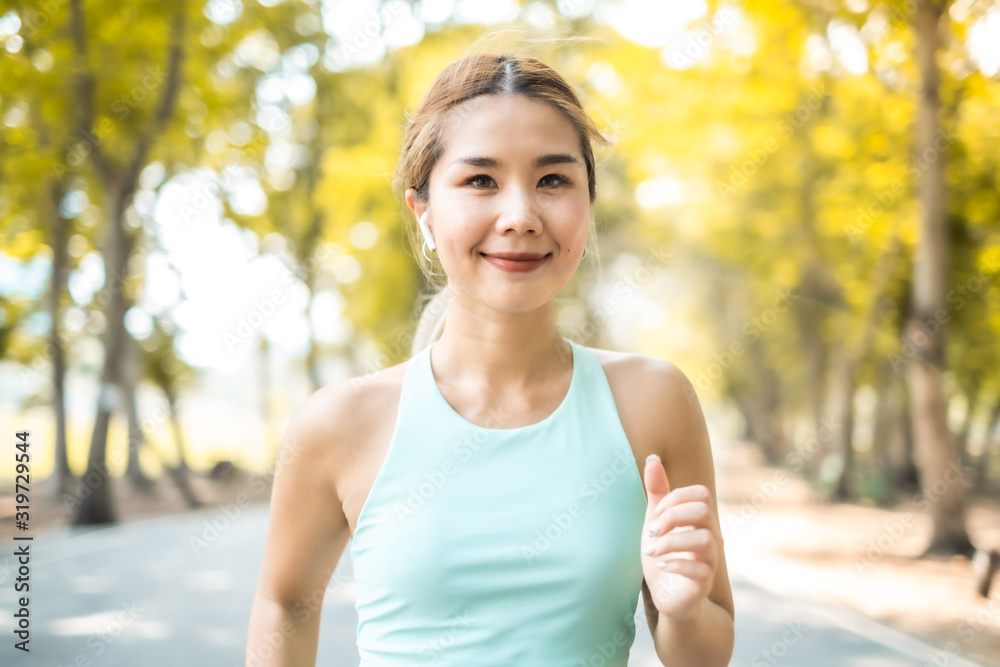 Running Asian woman. Female Runner Jogging during Outdoor Workout in a Park. Asian woman running in garden. Her morning exercise. Running Asian woman. Female Runner Jogging during Outdoor Workout in a Park. Asian woman running in garden. Her morning exercise.