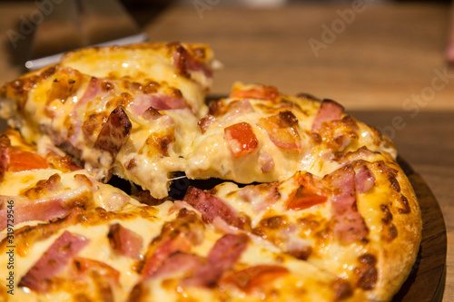 close up hot cheese pizza with bacon