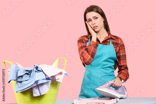 Tired young housewife with ...
