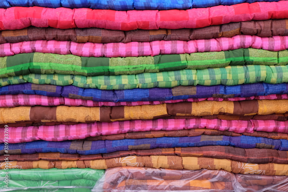 Soft, colorful blankets with beautiful patterns, popular in rural Thailand.