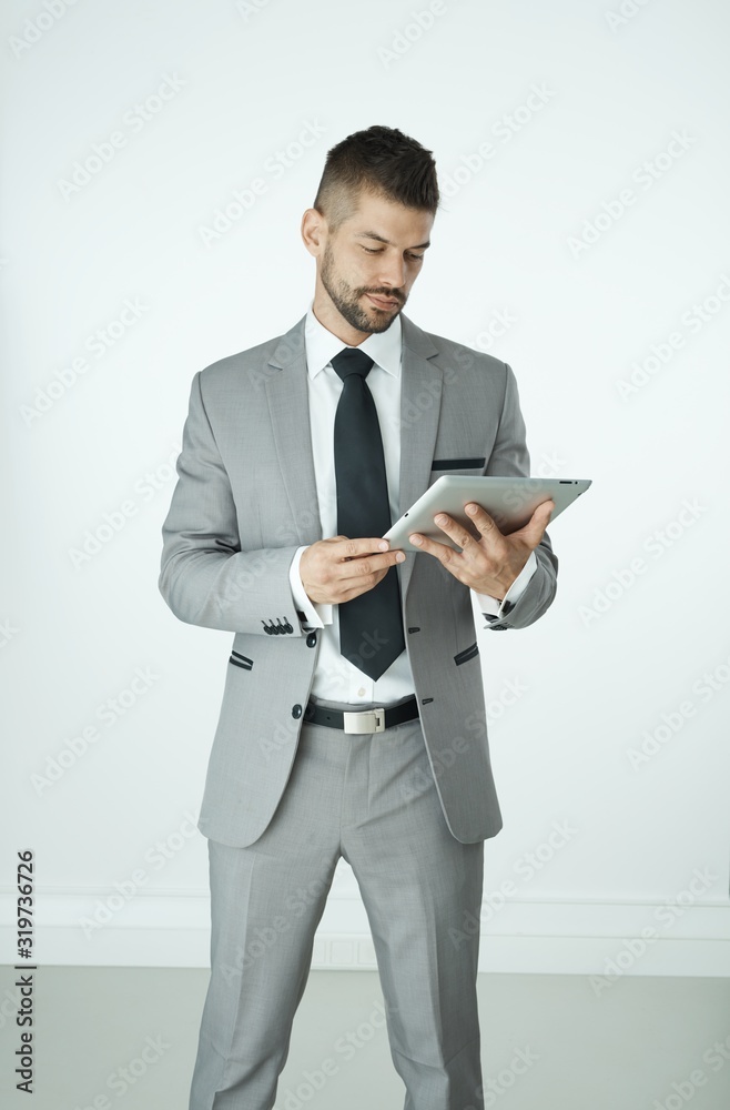 Businessman using tablet isolated on white Businessman using tablet isolated on white