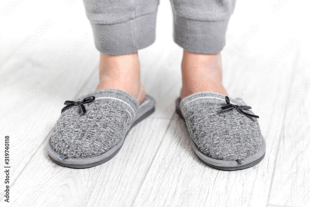 Modern portrait of home slippers light gray on white background for fashion lifestyle design. Home footwear design collection.