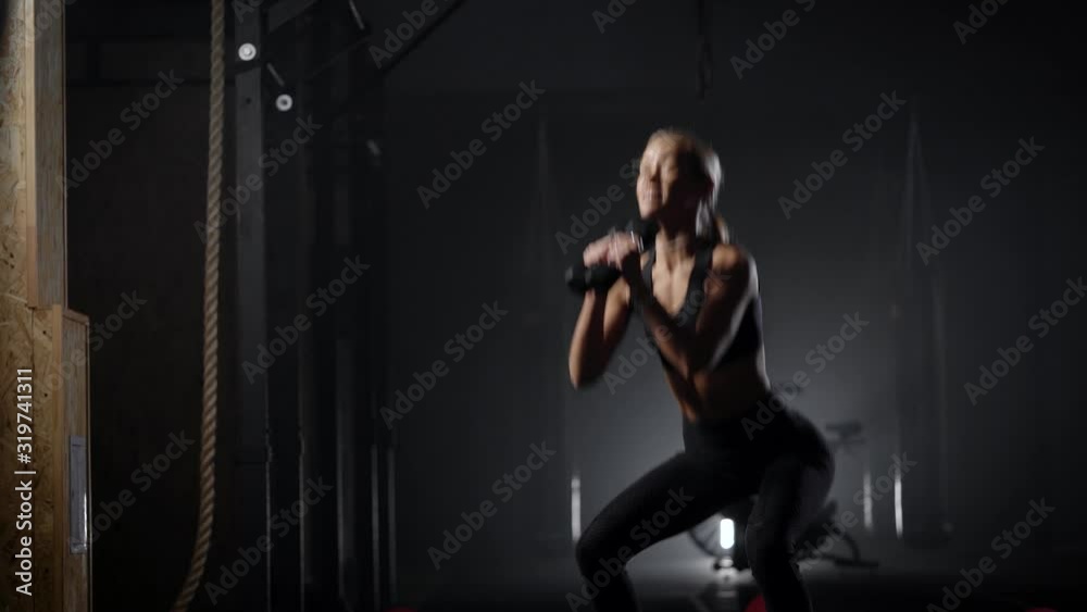 Beautiful young blonde is engaged in fitness. The woman performs exercises to maintain the figure. Slender body of a young girl. Healthy Beautiful young blonde is engaged in fitness. The woman performs exercises to maintain the figure. Slender body of a young girl. Healthy