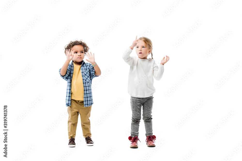surprised multicultural kids gesturing isolated on white surprised multicultural kids gesturing isolated on white