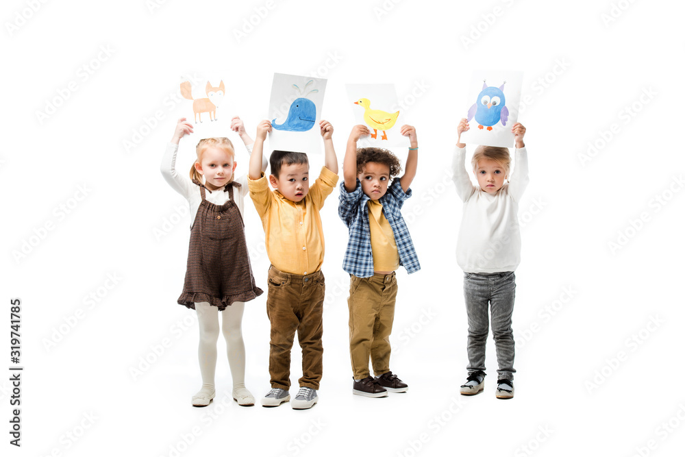 multicultural children holding paintings up, isolated on white multicultural children holding paintings up, isolated on white