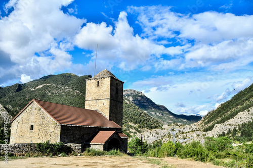 church in the mountains, photo as a background , in janovas fiscal sobrarbe , huesca aragon province photo