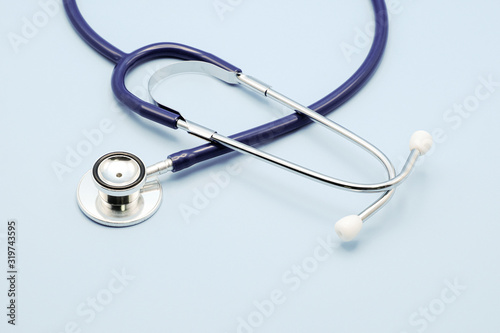 Stethoscope for doctor checkup on light blue background with copy space  healthcare and medical concept.