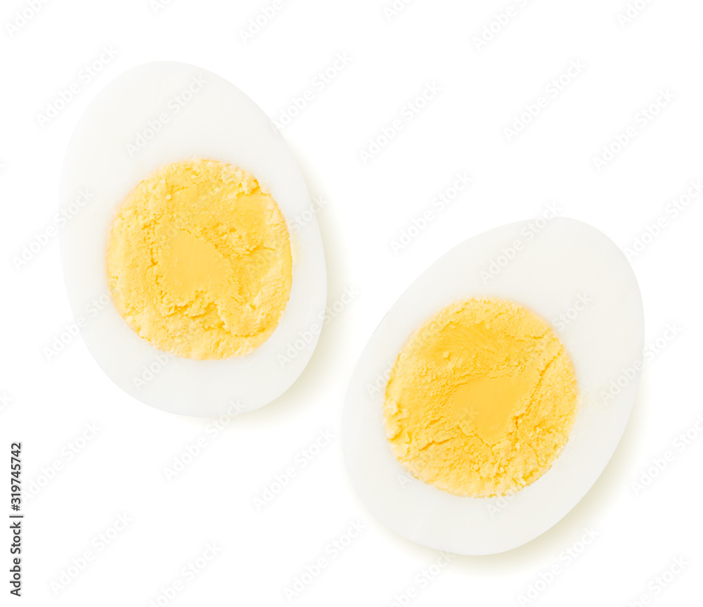 Fotografia Two halves of a boiled egg on a white. The view from the top