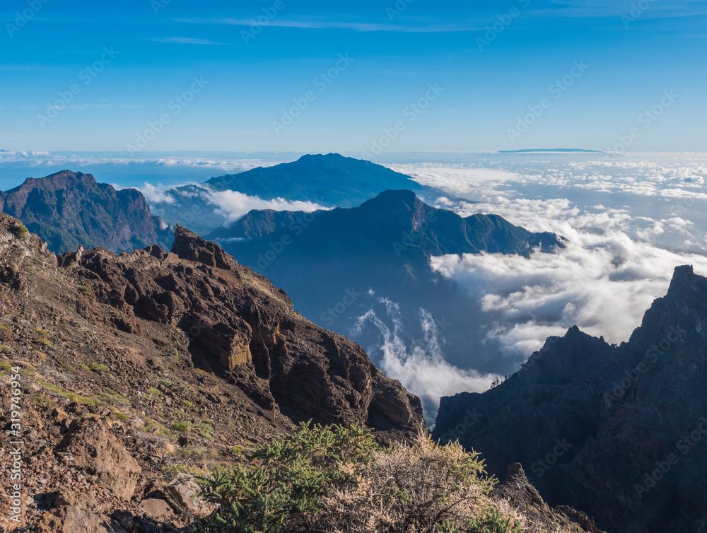 Landscape in the volcanic crater Caldera de Taburiente Natoional Park from mountain peak of Roque de los Muchachos Viewpoint with white clouds. island La Palma, Canary Islands, Spain