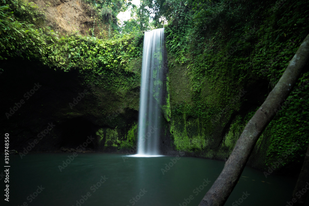 The beautiful Tibumana Waterfall (air terjun Tebumana) near Ubud, Bali